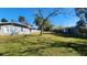 Large backyard with a spacious lawn at 623 Unabelle Ave, Holly Hill, FL 32117