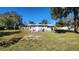 Backyard with deck and large grassy area at 623 Unabelle Ave, Holly Hill, FL 32117