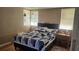 Bedroom with a double bed, nightstand, and two windows at 623 Unabelle Ave, Holly Hill, FL 32117