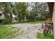 Large backyard with mature trees and a partially cleared area at 627 Clark St, Daytona Beach, FL 32114