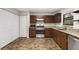 Well-equipped kitchen featuring wood cabinets and granite countertops at 627 Clark St, Daytona Beach, FL 32114