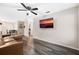 Living room with brown sectional sofa and hardwood floors at 627 Clark St, Daytona Beach, FL 32114