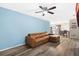 Living room with brown sectional sofa and hardwood floors at 627 Clark St, Daytona Beach, FL 32114