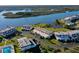 Aerial perspective of waterfront condos, surrounded by green lawns and serene waterways at 66 Ocean Palm Villa S, Flagler Beach, FL 32136