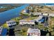 Aerial view of waterfront property with a river, condos, and landscaped grounds at 66 Ocean Palm Villa S, Flagler Beach, FL 32136