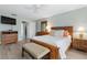 A bedroom with wooden furniture and a large bed with wooden floors at 66 Ocean Palm Villa S, Flagler Beach, FL 32136