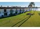 Exterior view of condos with lawns and balconies overlooking the waterfront at 66 Ocean Palm Villa S, Flagler Beach, FL 32136