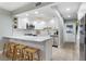 Modern kitchen featuring white cabinets, quartz countertops, and stainless steel appliances at 66 Ocean Palm Villa S, Flagler Beach, FL 32136