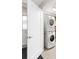 Convenient laundry room featuring stacked washer and dryer, maximizing space in this home at 66 Ocean Palm Villa S, Flagler Beach, FL 32136