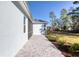 Home exterior with paver patio and grassy backyard at 707 Hang Loose Way, Daytona Beach, FL 32124