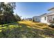 Large backyard with multiple homes visible at 707 Hang Loose Way, Daytona Beach, FL 32124