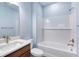 Bathroom with white subway tile, bathtub and vanity at 707 Hang Loose Way, Daytona Beach, FL 32124