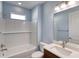 Bathroom with white subway tile, bathtub and vanity at 707 Hang Loose Way, Daytona Beach, FL 32124