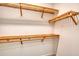 Ample closet shelving with wooden racks for clothing and storage at 707 Hang Loose Way, Daytona Beach, FL 32124