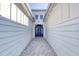 Front entry with a blue door and brick pavers at 707 Hang Loose Way, Daytona Beach, FL 32124