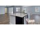 Kitchen island with white quartz countertop and stainless steel dishwasher at 707 Hang Loose Way, Daytona Beach, FL 32124