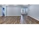 Spacious living area with wood-look tile floors at 707 Hang Loose Way, Daytona Beach, FL 32124