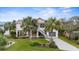 Elevated two-story home with spacious yard and palm trees at 124 Avalon Dr, Ormond Beach, FL 32176