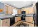 Modern kitchen with stainless steel appliances and dark countertops at 124 Avalon Dr, Ormond Beach, FL 32176