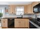 Modern kitchen with stainless steel appliances and dark countertops at 124 Avalon Dr, Ormond Beach, FL 32176