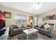 Living room with grey sofas, a TV, and access to an outdoor patio at 124 Avalon Dr, Ormond Beach, FL 32176