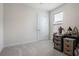 Simple bedroom with carpeted floor and small dresser at 2840 Monaghan Dr, Ormond Beach, FL 32174