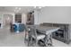 Kitchen dining area with a large wooden table and gray cabinets at 2840 Monaghan Dr, Ormond Beach, FL 32174