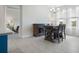 Dining area with a table and chairs, view into bedroom beyond at 2840 Monaghan Dr, Ormond Beach, FL 32174