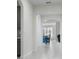 A light hallway with arched doorways leading to other rooms at 2840 Monaghan Dr, Ormond Beach, FL 32174