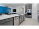 Modern kitchen with gray cabinets, stainless steel appliances, and an island at 2840 Monaghan Dr, Ormond Beach, FL 32174