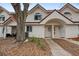 Two-story stucco townhome with Spanish tile roof and walkway at 3548 Forest Branch Dr # C, Port Orange, FL 32129
