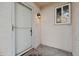 White front door with glass panel and exterior light fixture at 3548 Forest Branch Dr # C, Port Orange, FL 32129
