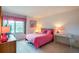 Bedroom with double bed, dresser, and ocean view at 4641 S Atlantic Ave # 2010, Port Orange, FL 32127