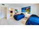 Bedroom with two twin beds and access to bathroom at 4641 S Atlantic Ave # 2010, Port Orange, FL 32127