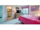 Bright bedroom with a double bed and ensuite bathroom at 4641 S Atlantic Ave # 2010, Port Orange, FL 32127