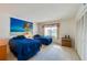 Bedroom with two twin beds and beach-themed art at 4641 S Atlantic Ave # 2010, Port Orange, FL 32127