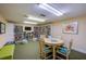 Community library with bookshelves and seating area at 4641 S Atlantic Ave # 2010, Port Orange, FL 32127