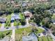 Aerial view showing home, landscaping, and driveway at 56 Winding Creek Way, Ormond Beach, FL 32174