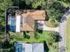 Aerial view showcasing home and pool area at 56 Winding Creek Way, Ormond Beach, FL 32174