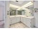 Double vanity bathroom with marble countertop and large mirror at 56 Winding Creek Way, Ormond Beach, FL 32174