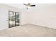 Bedroom with sliding doors leading to a sunroom at 56 Winding Creek Way, Ormond Beach, FL 32174