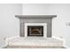 Corner fireplace with a gray mantel and white brick at 56 Winding Creek Way, Ormond Beach, FL 32174