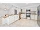 Bright kitchen with stainless steel appliances and granite countertops at 56 Winding Creek Way, Ormond Beach, FL 32174