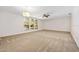 Bright living room featuring carpet and ceiling fan at 56 Winding Creek Way, Ormond Beach, FL 32174