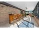 Inviting poolside patio with bar and seating area at 56 Winding Creek Way, Ormond Beach, FL 32174