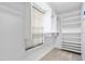 Large walk-in closet with built-in shelving and hanging rods at 56 Winding Creek Way, Ormond Beach, FL 32174