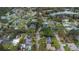 Aerial view of a residential neighborhood featuring houses and a lake at 89 Hickory Hills Cir, Ormond Beach, FL 32174