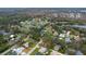 Aerial perspective of houses in a neighborhood near a lake at 89 Hickory Hills Cir, Ormond Beach, FL 32174