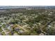 Aerial view showing a neighborhood's layout, featuring houses and lush green spaces at 89 Hickory Hills Cir, Ormond Beach, FL 32174