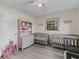 Bedroom with two cribs, a dresser and plenty of natural light at 89 Hickory Hills Cir, Ormond Beach, FL 32174